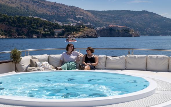 Women sitting on ship sundeck
